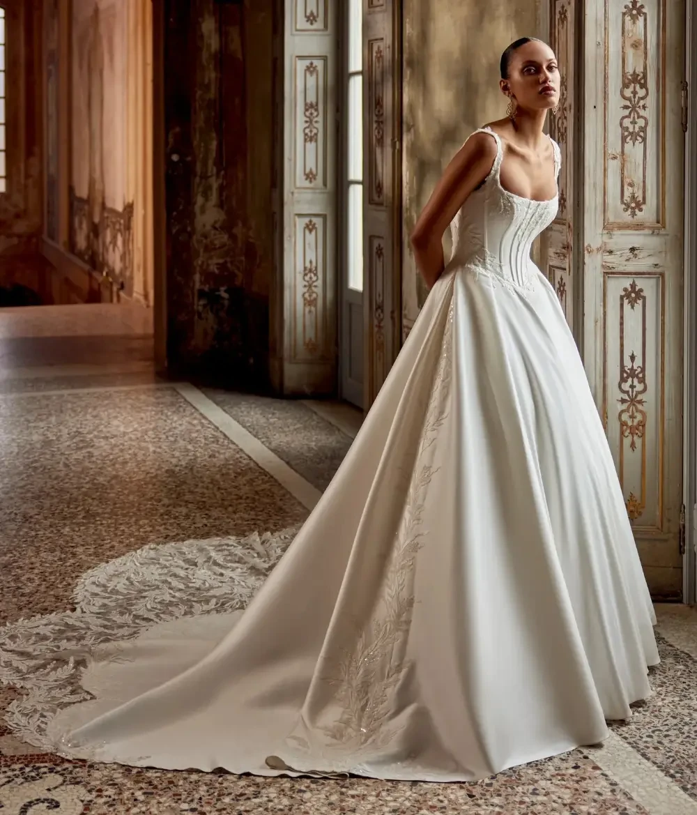 Model wearing a white gown by Justin Alexander