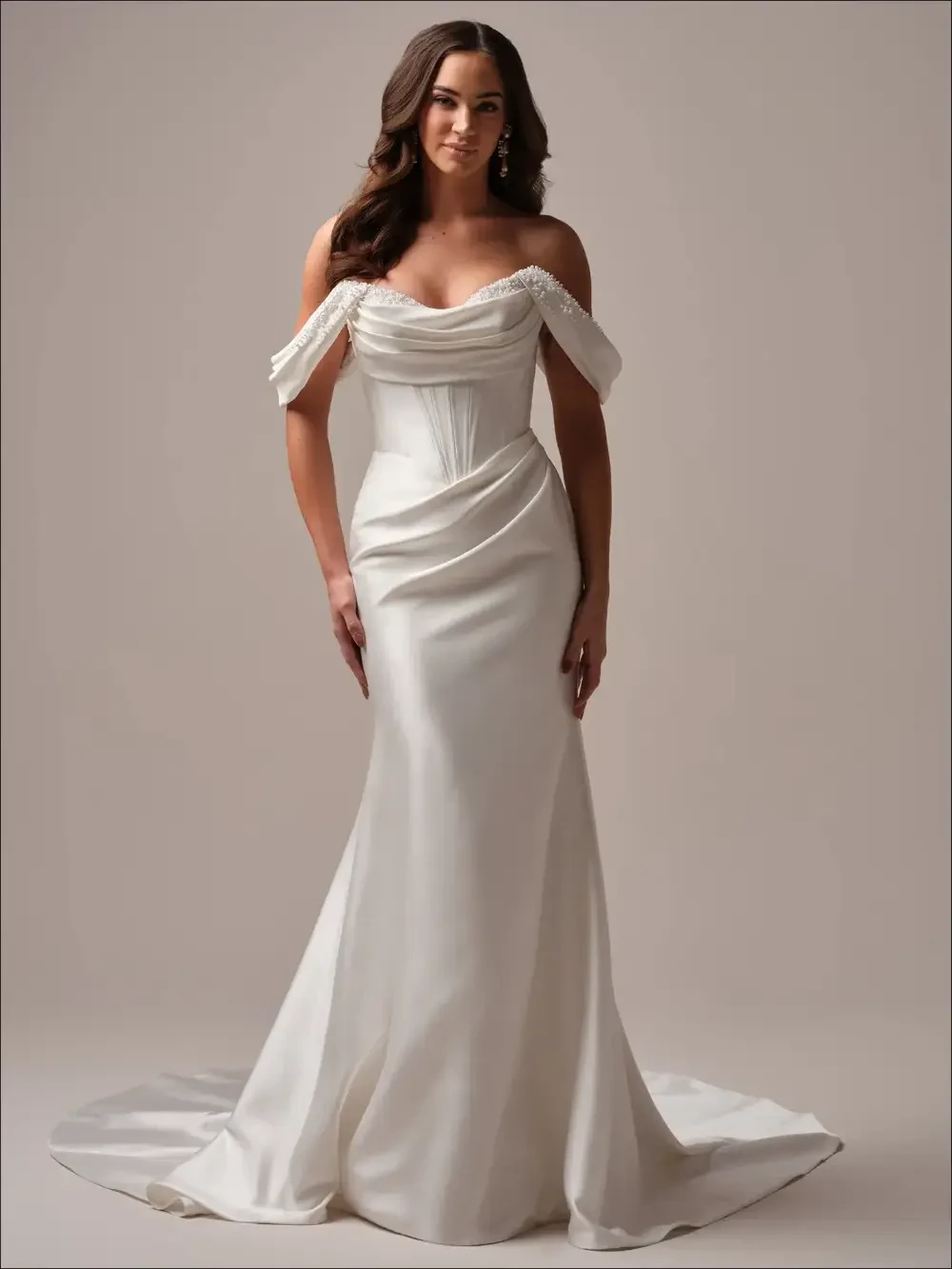 Model wearing a white gown by Maggie Sottero